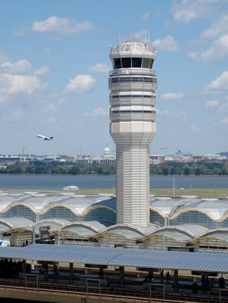tower and plane taking off from DCA