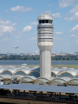 tower and plane taking off from DCA
